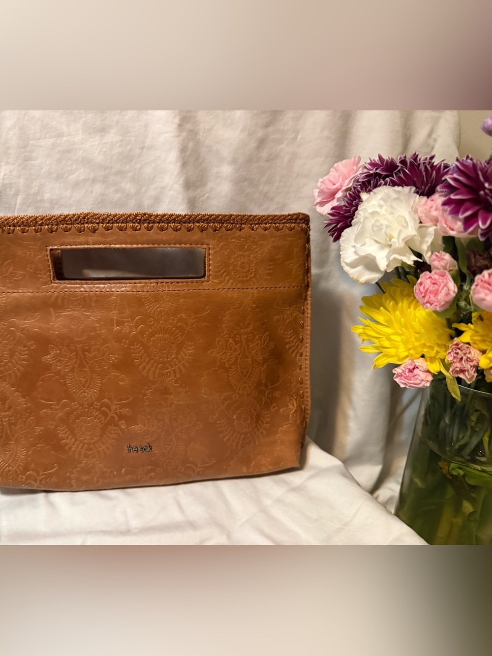 The Sak Tan Embossed Leather Wristlet Clutch in Cognac